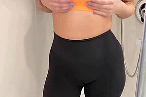 Hey, that hot brunette babe teases in her sports bra and leggings under the shower spray