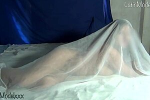 Silly Latina Strips Naked Under Sheets