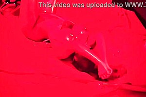 ms red x tempts with her glazed strip tease, revealing shaved body and exotic curves