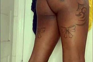 Ebony tattooed slut moans while squirting on dildo