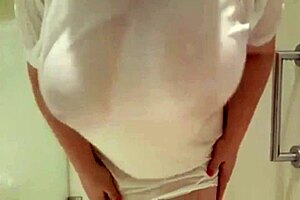 Sheila's big tits soak in the shower