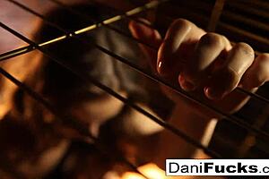 dani daniels caged and masturbating her pussy!