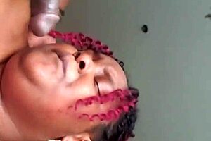 The redhead bends over for intense doggystyle action with her ebony partner.