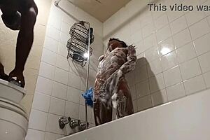 Curvy Caramel Woman Bathing In Shower