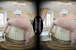 Jemma's getting naughty in the kitchen, fingering her shaved pussy in VR