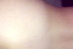 a young brunette beauty explores her small natural tits in an erotic solo