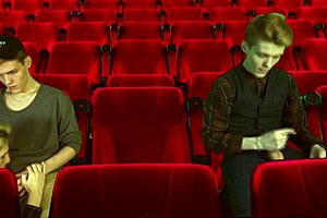 Cinema hall threesome features 2 tops dominating 1 bottom 😈