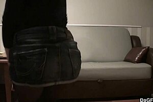 A tight brunette teen strips on the sofa, ripping her pantyhose in a solo show.