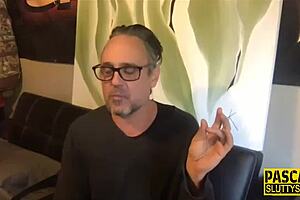 Bound kinky BDSM whore gags on toy during deepthroat choking session.