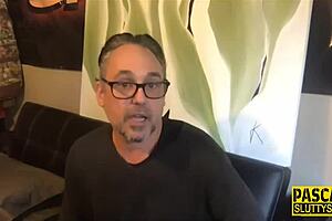 Bound kinky BDSM whore gags on toy during deepthroat choking session.