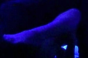 Scarlett Johnson Engages In Intense Blacklight Sex Fetish Scene Left 3