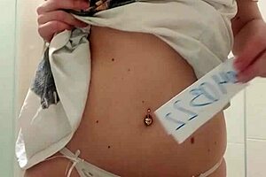 Beautiful horny woman fingers wet pussy in bathroom, moaning to orgasm