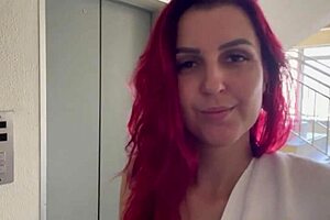 In the shared hostel bathroom, redhead gives handjob during shower