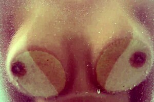 In the shared hostel bathroom, redhead gives handjob during shower