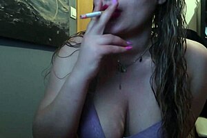 This curvaceous blonde slut sucks dick and takes drags from a cigar whilst playing all alone