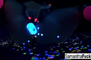 samantha saint performs a solo in black light.