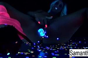 samantha saint performs a solo in black light.