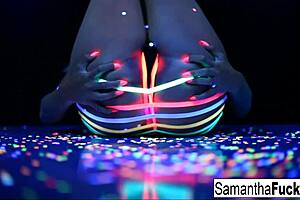 samantha saint performs a solo in black light.
