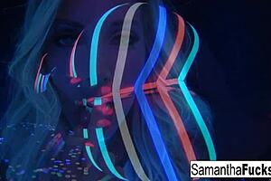 samantha saint performs a solo in black light.