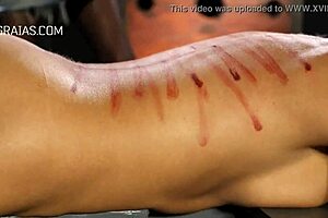 brutal domina whips her bound redhead slave hard!