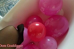 Balloons and Stockings Mesmerize in Bathroom Fetish