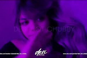 Asian beauty with large bust starts to tease on cam