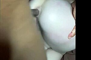 Christi Snow is having her ass drilled by a dark-skinned black man with a huge cock