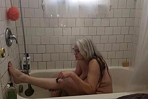 hot mature momma vee shaves her pussy and masturbates in the shower