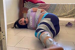 ball gagged girl struggles in tight barefoot tape bondage