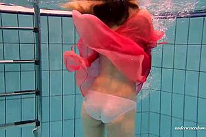 Slutty Teen Swims and Strips Underwater