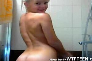 blonde teen smiles during nuru massage