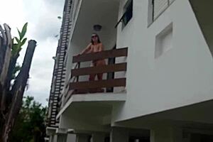 I caught my neighbor naked on the balcony. She called me up to her apartment to fuck her.