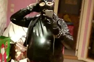 Shemale interacts with real doll in rubber scene