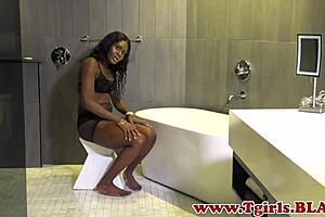 Ebony trans babe tugs her big black cock