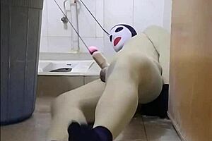 zentai slave bound in penis toilet bondage
