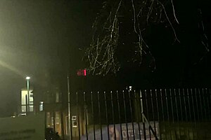 a street girl flashes passersby in the public outdoor area