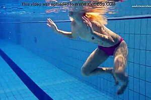 I admire the absolute underwater blonde beauty Elena Proklova in the pool. Her tattoos and natural tits shine beautifully.