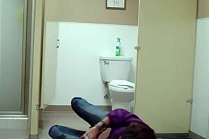 staci onit on the bathroom floor in a public outdoor fetish scene