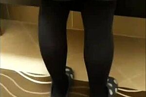 italian mature woman models black nylons in leggings