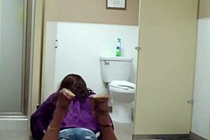 staci onit on the bathroom floor in a public outdoor fetish scene