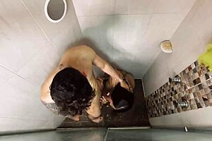 The delicious transgender Paisa girl feels intense pleasure as her boyfriend fucks her ass hard in the shower.