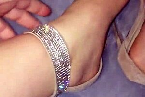 moisturizing feet with lotion on webcam