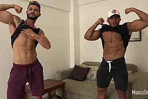 Two muscular hunks rip clothes for intense muscle worship and cock masturbation