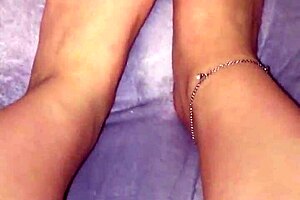 moisturizing feet with lotion on webcam