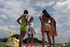 Party Girls Outdoors in Miniskirts and Sun Dresses Play Twister Without Panties