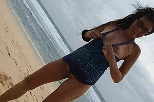 Gloria does no-panties yoga on wild beach with pink butt plug inserted