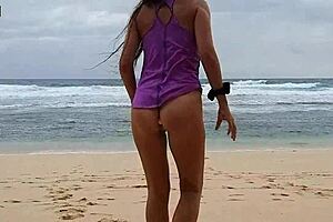 Gloria does no-panties yoga on wild beach with pink butt plug inserted