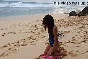Gloria does no-panties yoga on wild beach with pink butt plug inserted