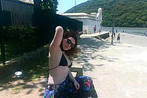 Young beautiful half naked girl on the beach
