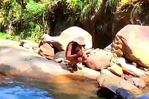 lilyan masturbates by river with dildo